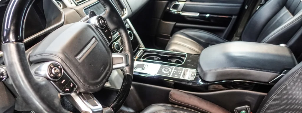 Mechanic diagnosing Land Rover electrical system in My Car Guy auto repair Plant City FL